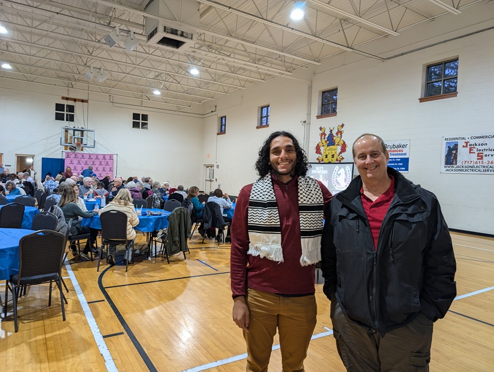 2024.11.22 - BSOC - Sally's Iron Mustangs - 2 Abdullah Abu-Mahfouz (left) poses for a photo with George Winchell (right) at the Bright Side Opportunities Center screening of Sally's Iron Mustangs, where over $30,000 was raised during their Big Give campaign.